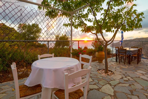 Zakinthos, Greece - 03.09.2022: Romantic terrace during sunset at a restaurant on Zakynthos (Ionic Islands, Kampi, Greece)