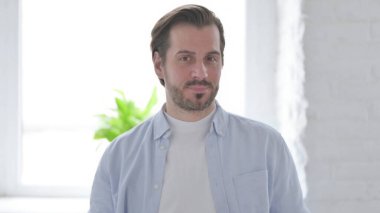 Portrait of Mature Man Shaking Head in Denial