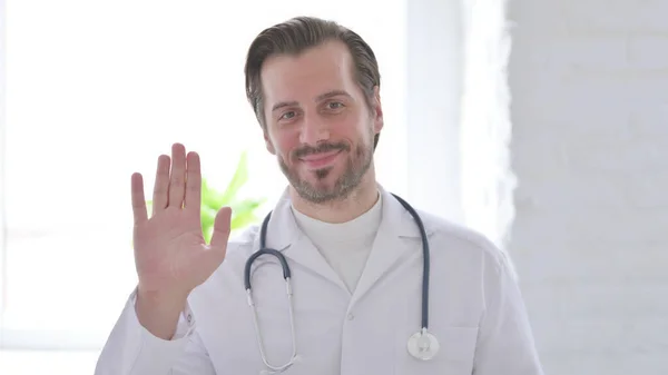 Portrait Male Doctor Waving Welcoming — Stockfoto