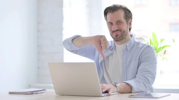 Mature Man Showing Thumbs While Using Laptop — Foto de Stock