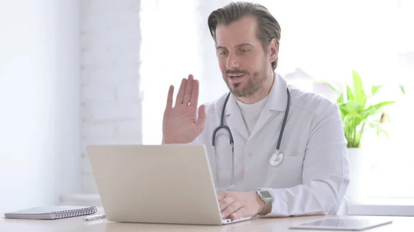 Male Doctor Talking Video Call Laptop Clinic — Foto de Stock