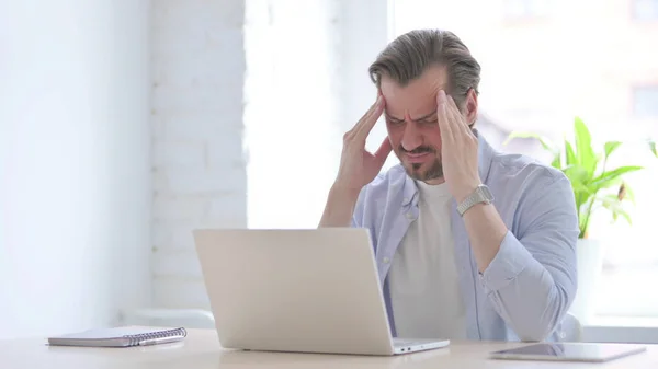 Mature Man Having Headache While Working Laptop — Stok fotoğraf