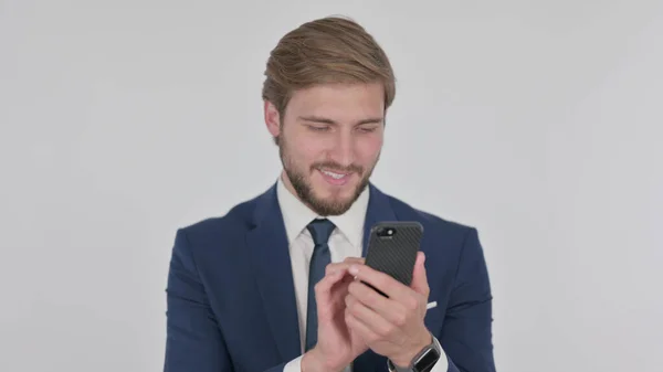 Young Adult Businessman Browsing Smartphone White Background — 图库照片