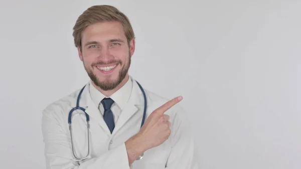 Young Adult Doctor Pointing Side White Background — Fotografia de Stock
