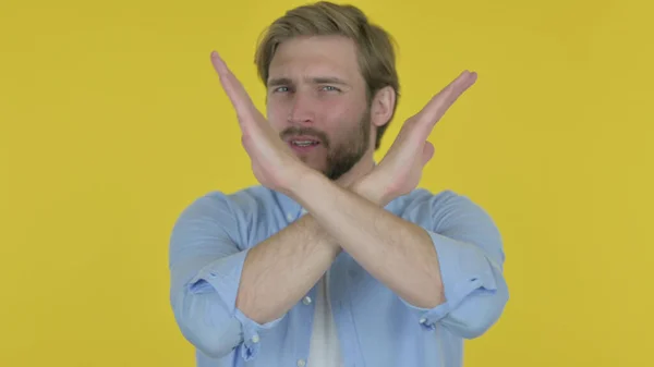 Rejecting Casual Young Man Arm Gesture Yellow Background — Φωτογραφία Αρχείου