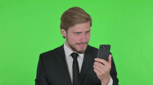 Young Adult Businessman Loss Smartphone Green Background — Fotografia de Stock