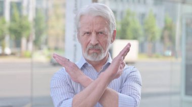 Portrait of Rejecting Senior Old Man Doing No Gesture Outdoor