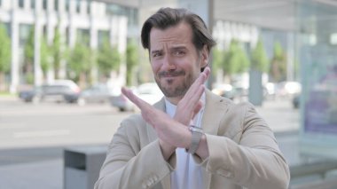 Outdoor Portrait of Rejecting Man Doing No Gesture