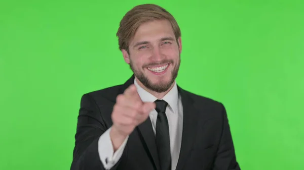 Young Adult Businessman Pointing Camera Green Background — 스톡 사진