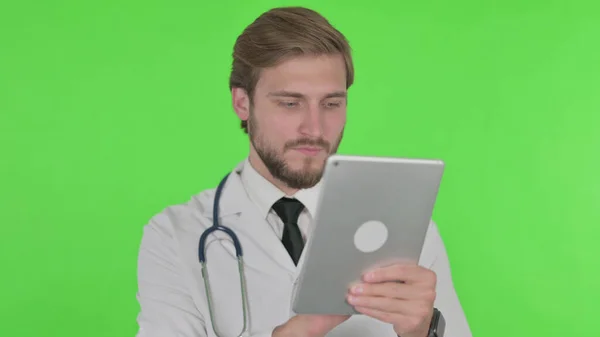 Young Adult Doctor Using Digital Tablet Green Background — Fotografia de Stock