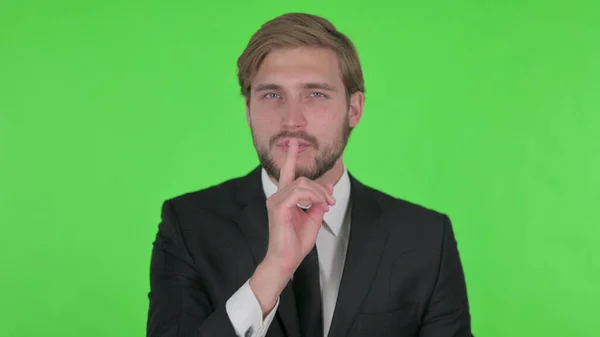 Young Adult Businessman Finger Lips Silence Green Screen — ストック写真