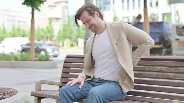 Man Having Back Pain While Sitting Bench — Stock Photo, Image