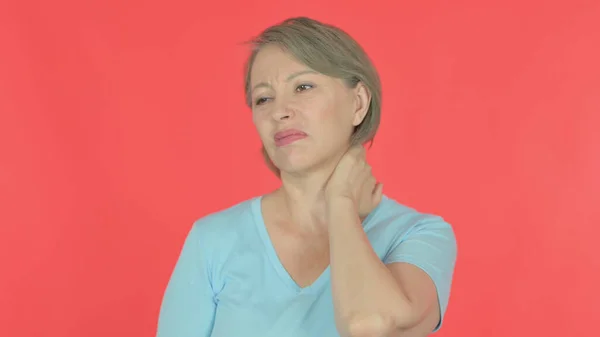 Senior Old Woman with Neck Pain on Red Background
