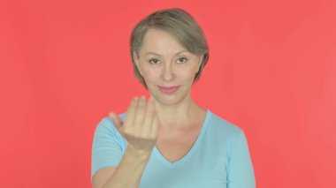 Senior Old Woman Inviting on Red Background