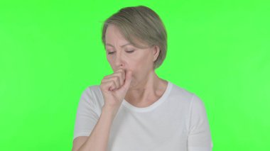 Senior Old Woman Coughing on Green Background