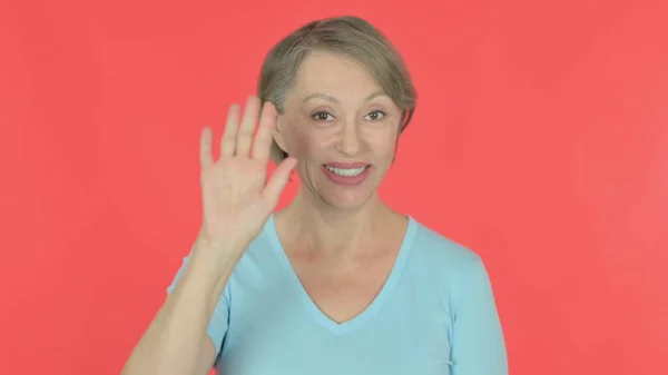 Senior Old Woman Waving Hand Say Hello Red Background — Stock Fotó