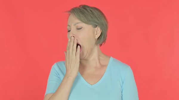 Tired Senior Old Woman Yawning Red Background — Fotografia de Stock