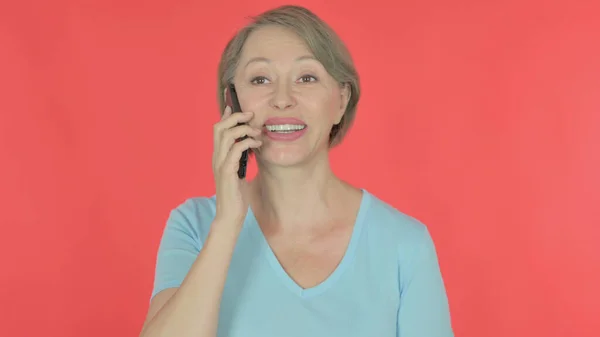 Senior Old Woman Talking Phone Red Background — Stockfoto