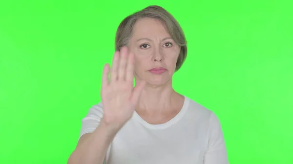 Stop Gesture Senior Old Woman Denial Green Background — Photo
