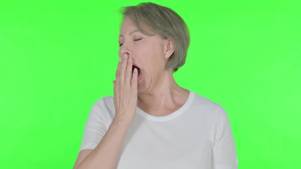 Tired Senior Old Woman Yawning Green Background — Foto Stock
