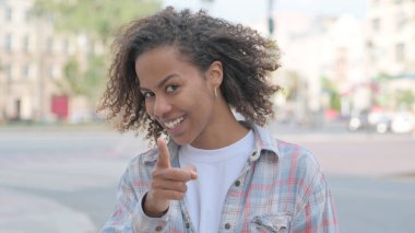 Young African Woman Pointing at the Camera Outdoor
