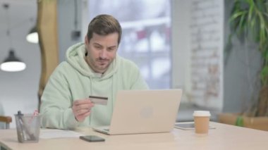 Young Adult Man Unable to make Online Payment on Laptop