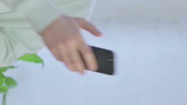 Vertical Video of Male Hand using Smartphone