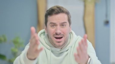 Disappointed Young Adult Man Reacting to Loss, Financial Failure