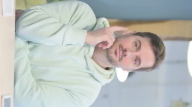 Vertical Video of Pensive Young Adult Man Thinking New Plan