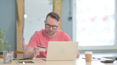 Young Adult Man Unable to make Online Payment on Laptop
