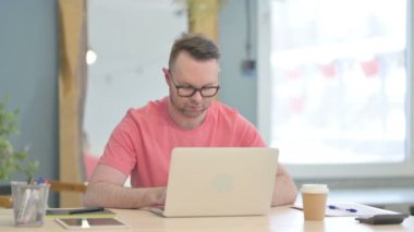 Vertical Video of Young Adult Man Celebrating Success on Smartphone