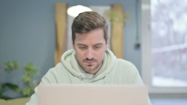 Close Young Adult Man Looking Camera While Using Laptop — Video Stock