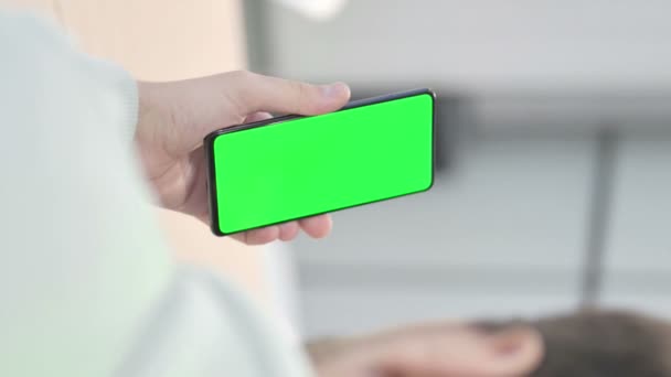Vertical Video Young Adult Man Using Smartphone Green Screen — 图库视频影像