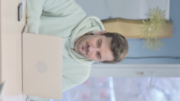 Vertical Video Young Adult Man Celebrating Success Laptop — Stockvideo