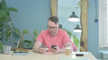 Creative Senior Old Man Shopping Online with Bank Card