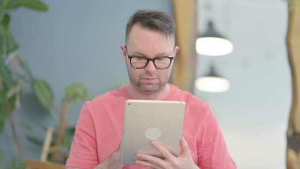 Young Adult Man Browsing Internet Digital Tablet — Stock Video