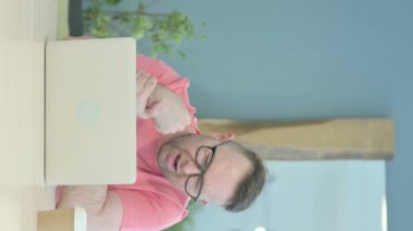 Vertical Video of Senior Old Man having Wrist Pain at Work