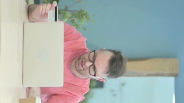 Vertical Video of Senior Old Man Enjoying Successful Online Shopping
