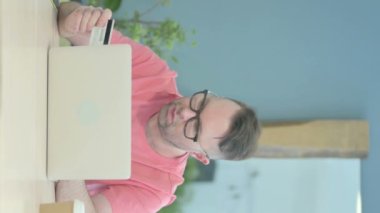 Vertical Video of Upset Senior Old Man Unable to make Online Payment