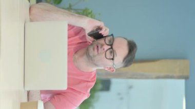 Vertical Video of Angry Senior Old Man Talking on Phone