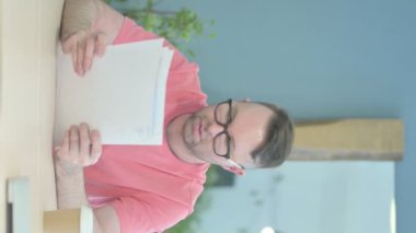 Vertical Video of Senior Old Man Reading Documents in Office, Paperwork