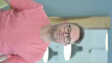 Vertical Portrait of Senior Old Man showing Thumbs Down