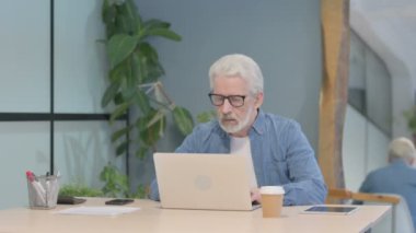 Senior Old Man Working on Laptop at Work