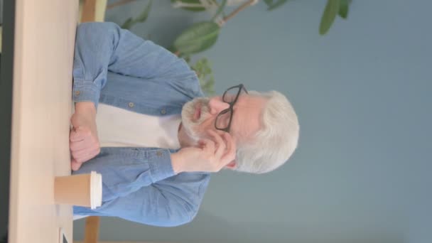 Vertical Video Pensive Senior Old Man Thinking While Sitting Work — Stockvideo