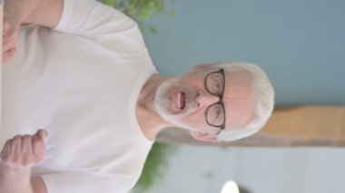 Vertical Video of Excited Senior Old Man Celebrating Success in Office