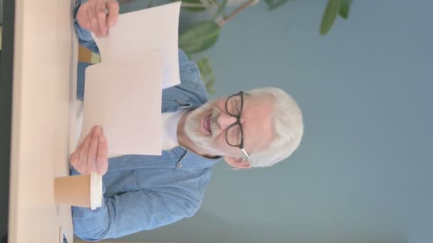 Vertical Video Senior Old Man Celebrating While Reading Documents Work — Stockvideo