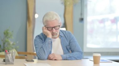 Tired Senior Old Man Sleeping in Office