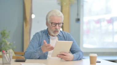 Senior Old Man Shocked by Loss on Digital Tablet