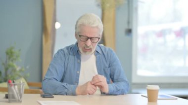 Tense Senior Old Man with Headache in Office, Migraine