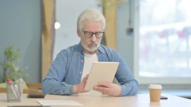 Senior Old Man Working on Digital Tablet